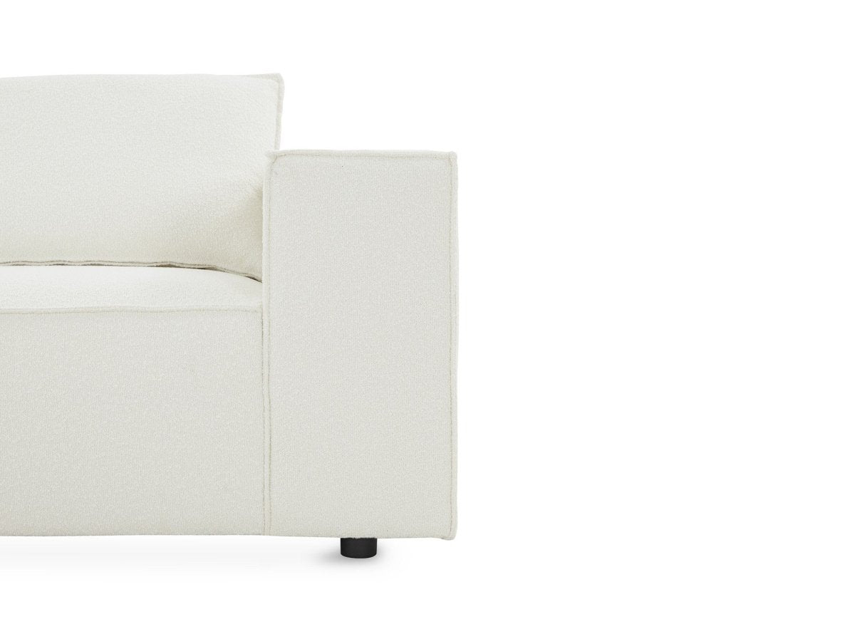 Canapé d'angle fixe modulable avec 1 pouf en tissu effet peau de mouton blanc écru HARLEM XL - DécoInParis